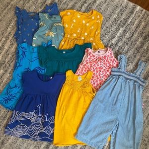 Large Tea lot size 2T (7 dresses), one Old Navy dress, one Gap romper.